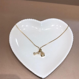 colar pata de cachorro e osso cristal