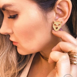 Brinco promocional onça dourada