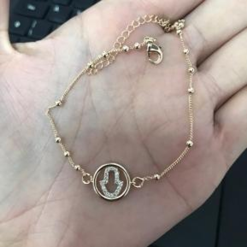 Pulseira bolinhas com medalha mão de fatima cravejada