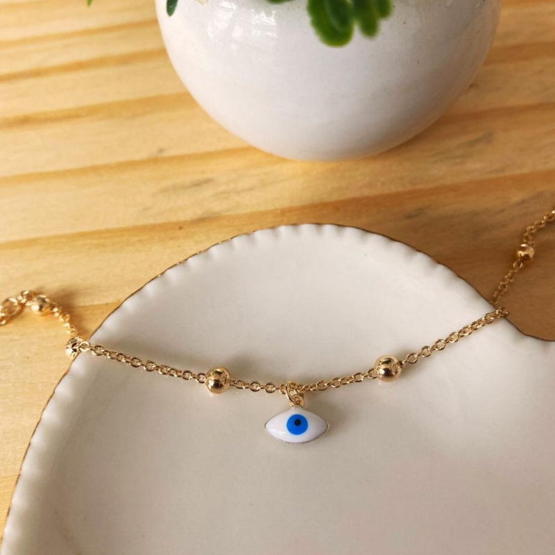 Pulseira bolinhas com olho pendurado
