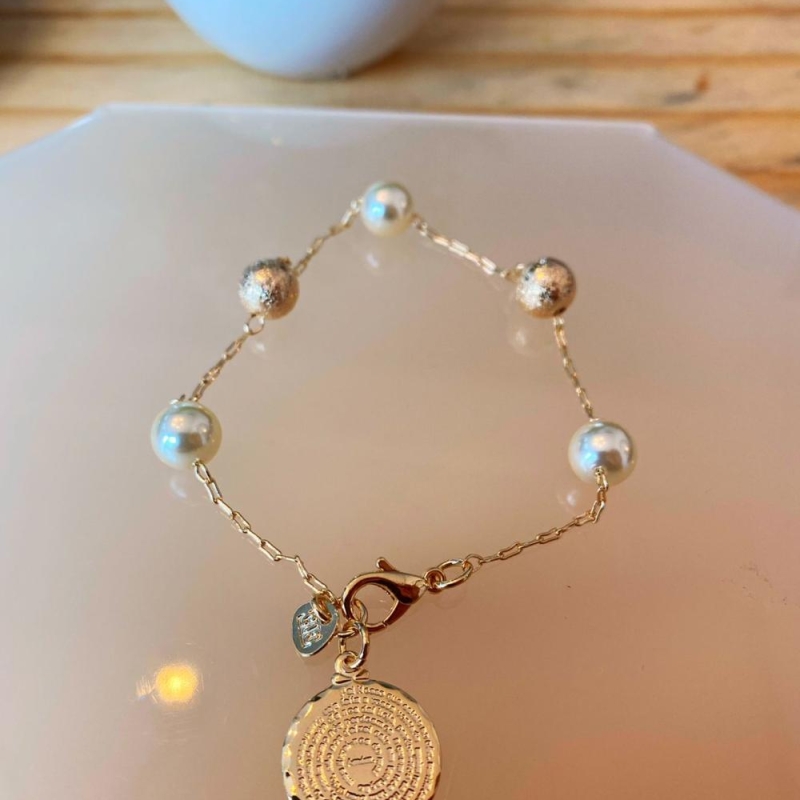 Pulseira pai nosso perolas e bola diamantada