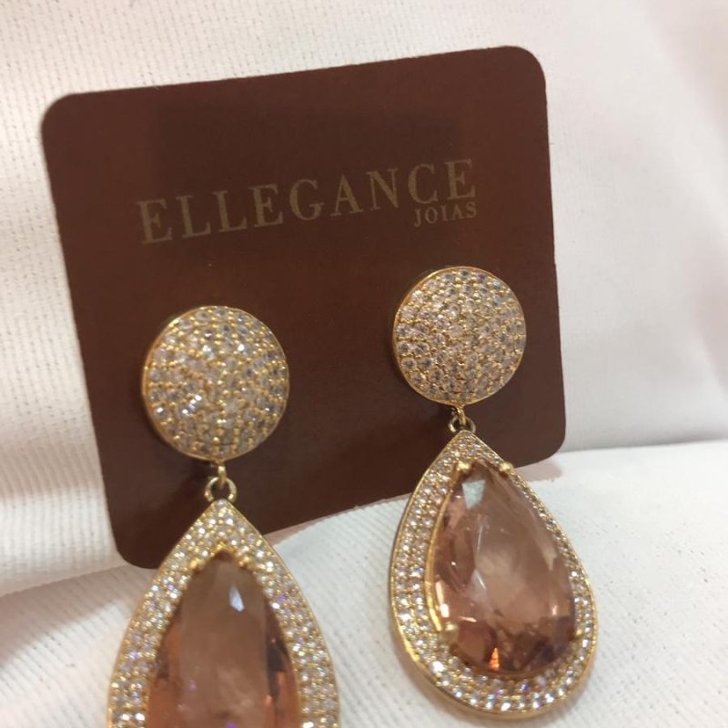 brinco com bola cravejada e cristal laranja metálico