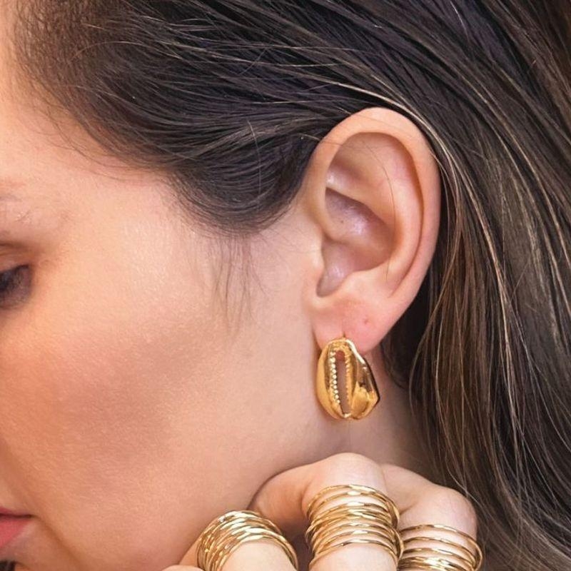 Brinco promocional  búzio dourado