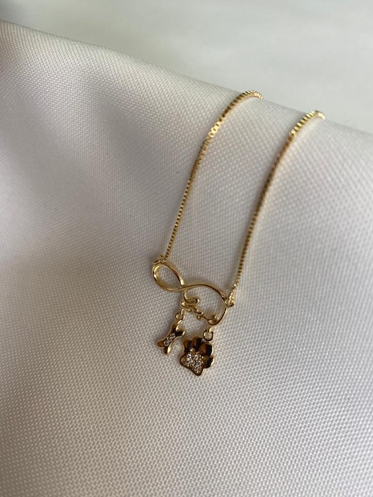 Colar Símbolo Infinito Love com Pingente de Osso e Patinha Cravejados