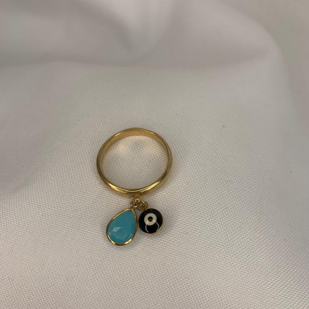 Anel Liso com Pingente Pedra de Zircônia Azul Claro Com Olho Grego Preto