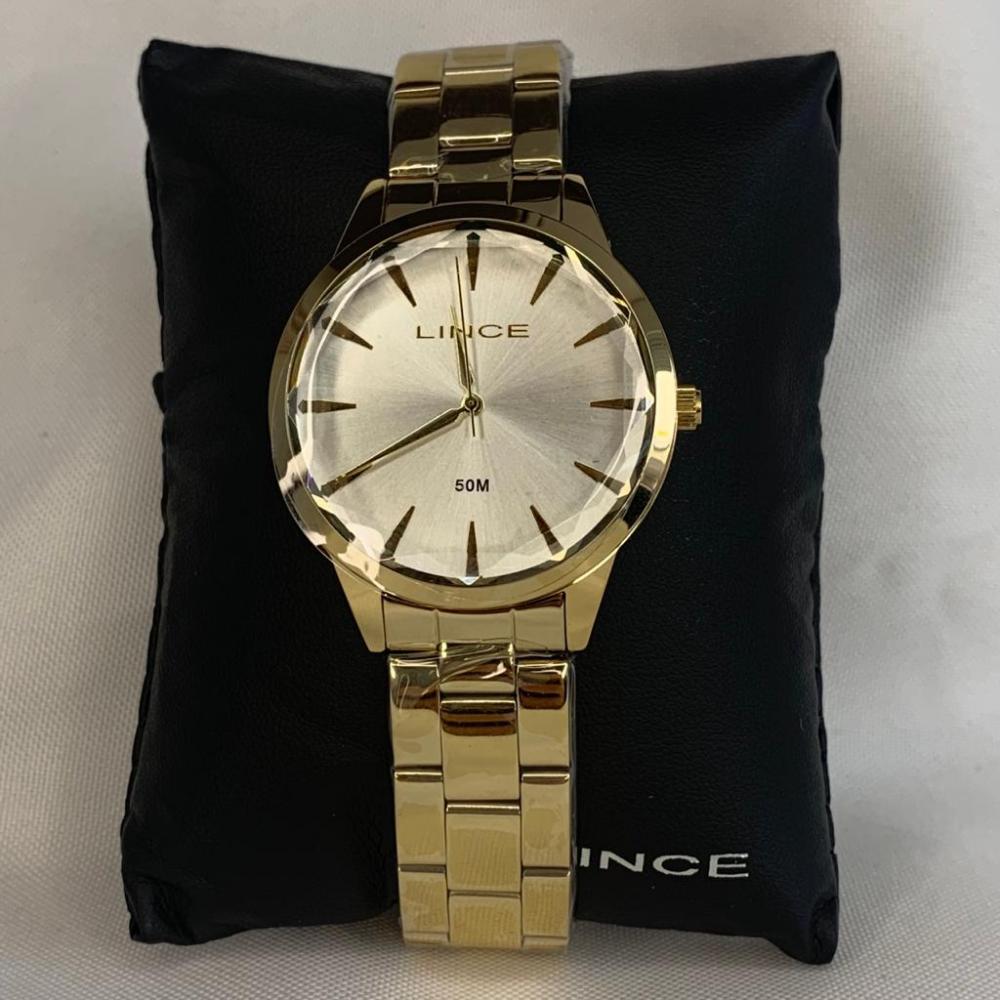 Relógio Lince Dourado com Fundo Branco de Ponteiro