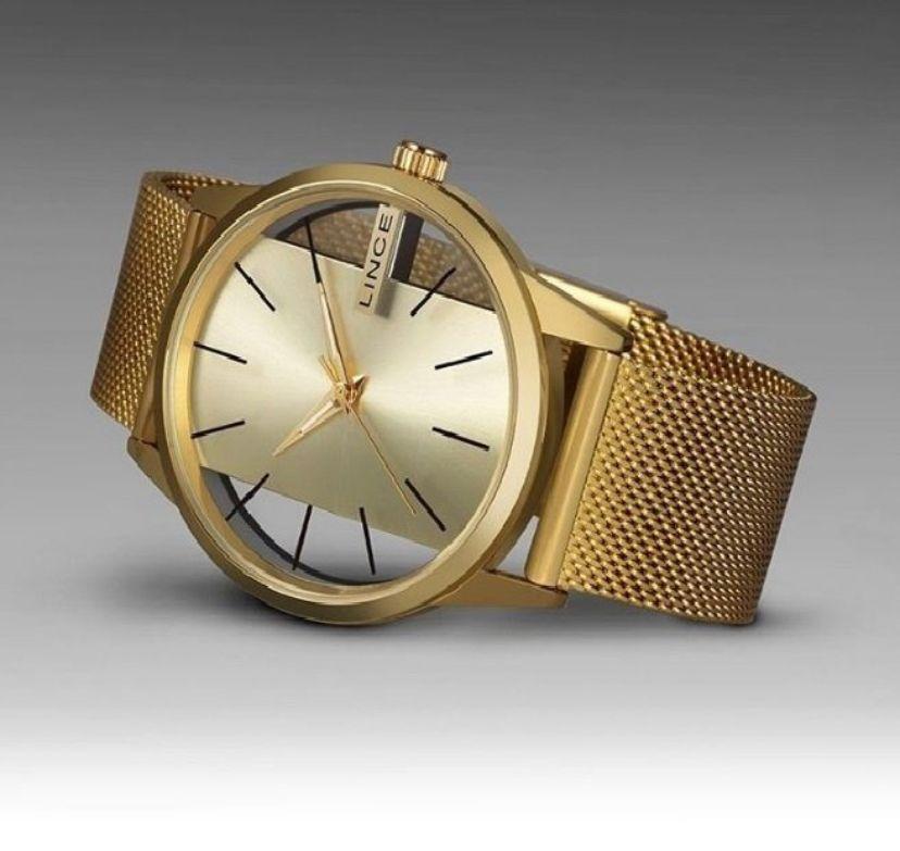 Relogio dourado lince transparente