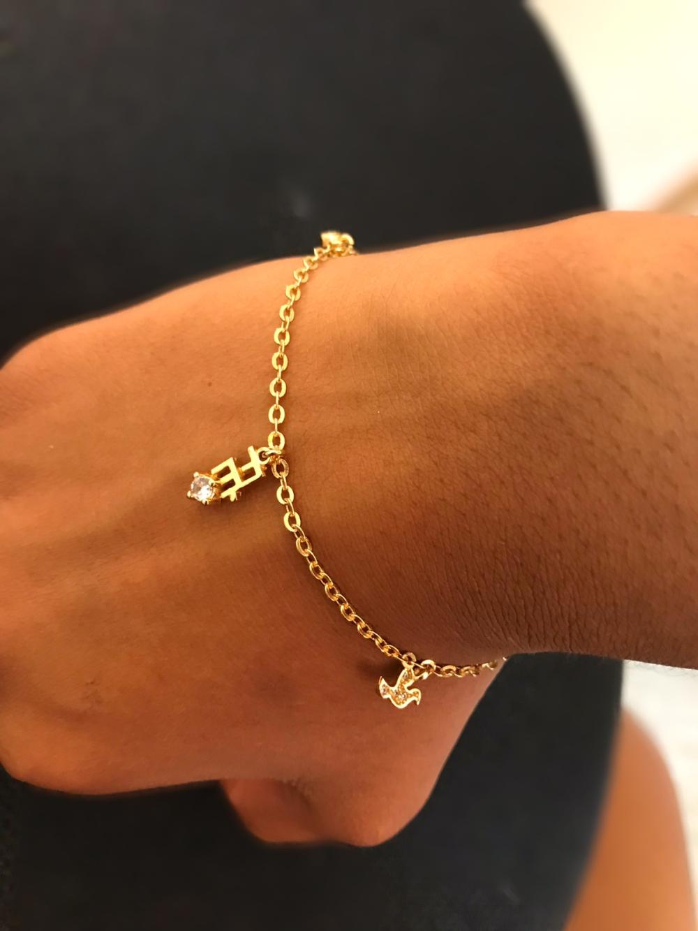 Pulseira fé com pomba da paz e ponto de luz