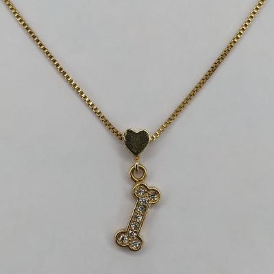 colar osso com cristal e pequeno coração dourado