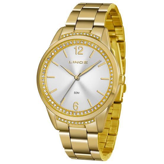 Relogio dourado com brilhod