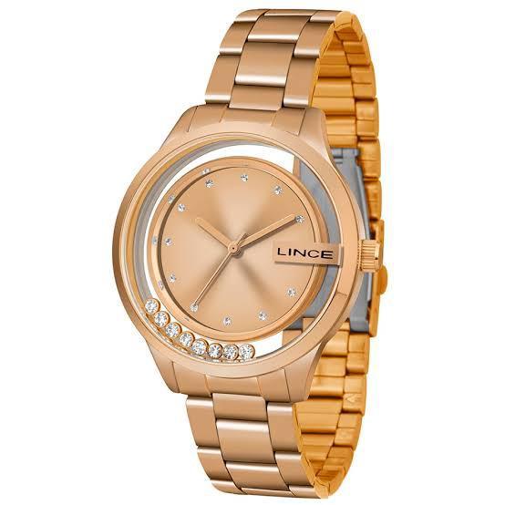 relogio dourado com detalhe